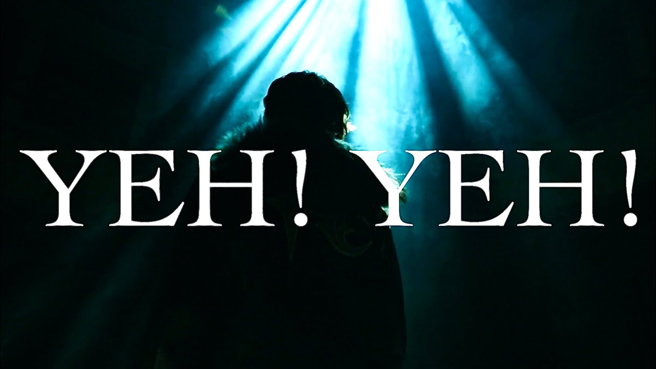 Samuel silhouetted under blue lights in the YEH! YEH! music video